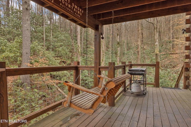 deck featuring a forest view