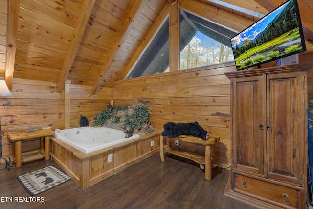 bathroom with vaulted ceiling with beams, wood walls, wood ceiling, a whirlpool tub, and wood finished floors