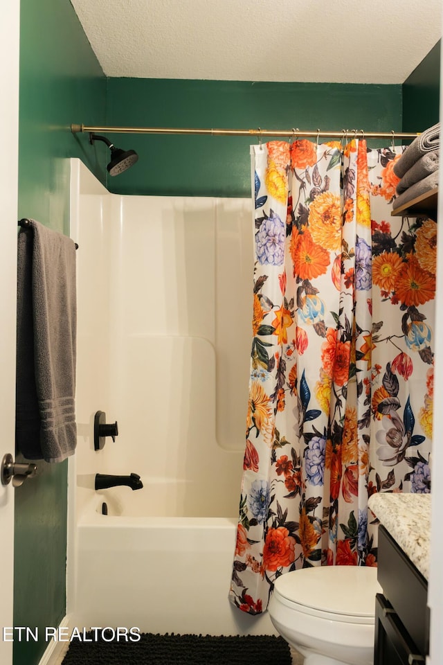 full bath featuring vanity, shower / bath combination with curtain, toilet, and a textured ceiling