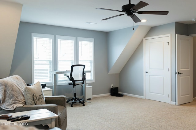exercise room with visible vents, a ceiling fan, baseboards, and light carpet