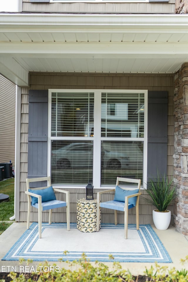 view of patio / terrace featuring central air condition unit and covered porch