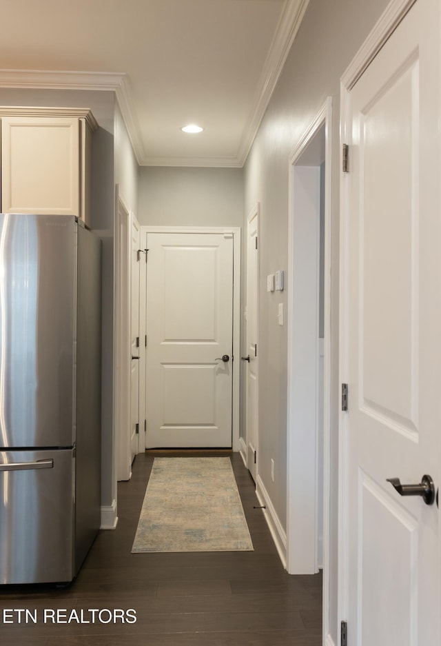 hall with recessed lighting, crown molding, baseboards, and dark wood-style flooring