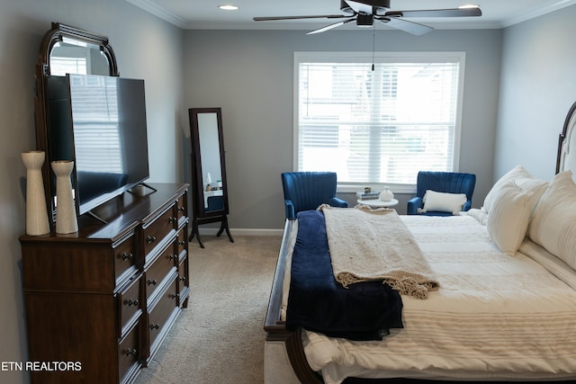 bedroom with baseboards, a ceiling fan, carpet flooring, and crown molding