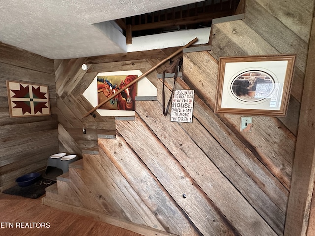 room details featuring a textured ceiling and wood finished floors