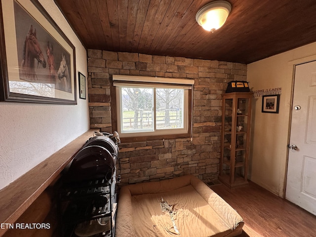 unfurnished bedroom with wood finished floors and wood ceiling