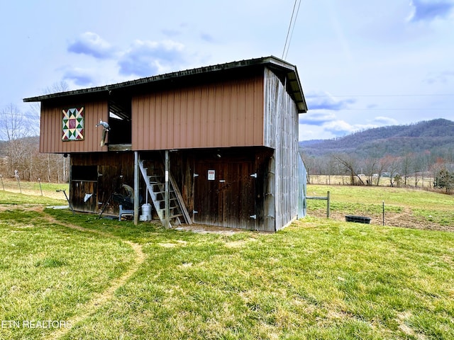 view of outbuilding featuring a mountain view and an outbuilding