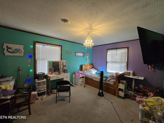 bedroom featuring a chandelier, a textured ceiling, crown molding, and carpet