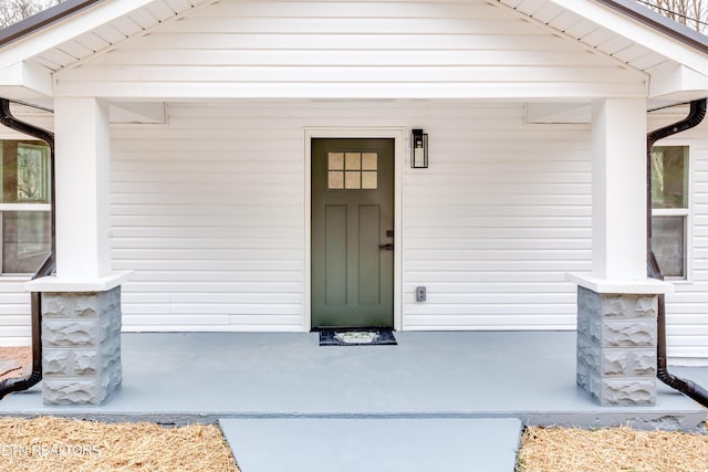 property entrance with covered porch