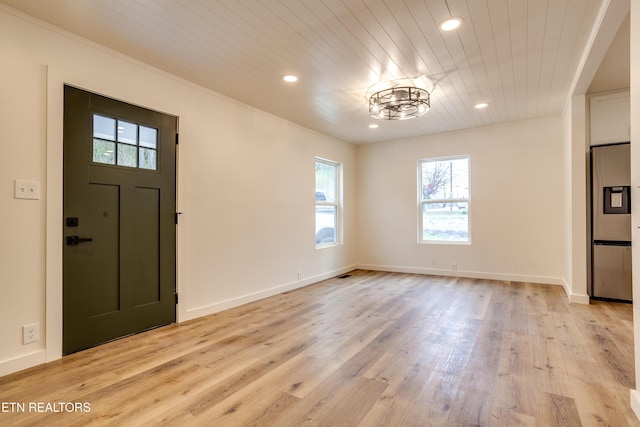 foyer featuring recessed lighting, light wood-style flooring, and wooden ceiling