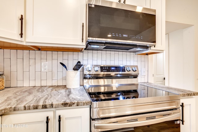 kitchen featuring white cabinetry, tasteful backsplash, and stainless steel appliances