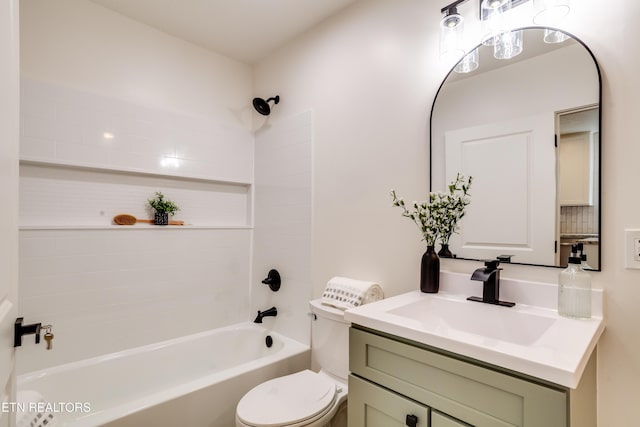 bathroom featuring shower / washtub combination, toilet, and vanity