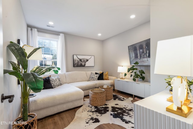 living room featuring visible vents, recessed lighting, and wood finished floors