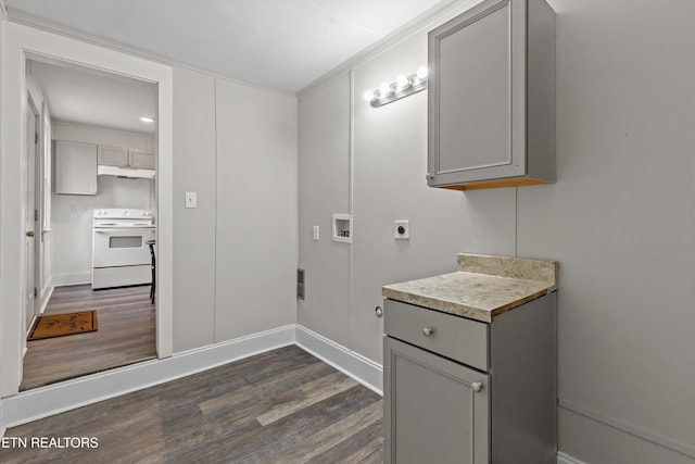 bathroom featuring baseboards, wood finished floors, and ornamental molding