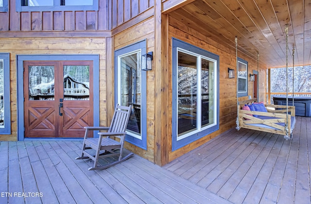 wooden terrace featuring a porch