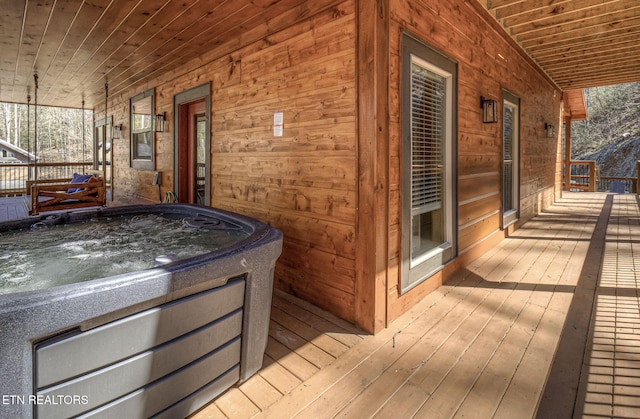 wooden deck featuring an indoor hot tub