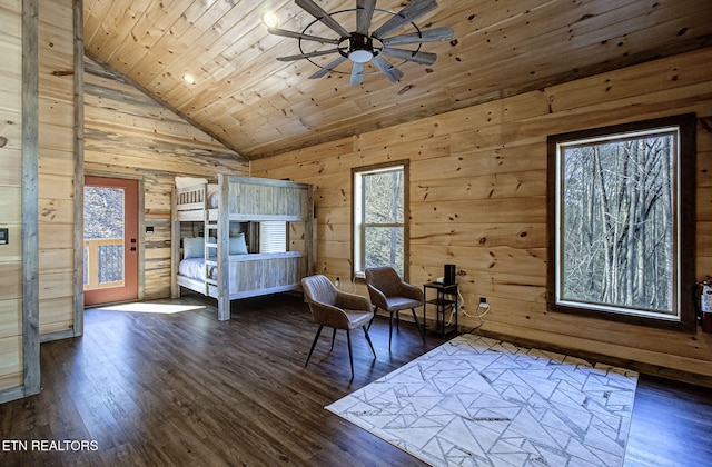 unfurnished bedroom featuring wood walls, wood ceiling, lofted ceiling, and wood finished floors