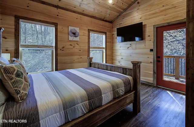 bedroom featuring wooden walls, wooden ceiling, lofted ceiling, and wood finished floors