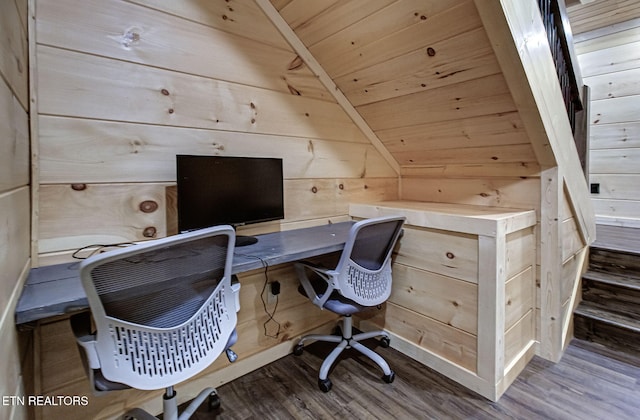 office with wooden ceiling, wood finished floors, and wood walls