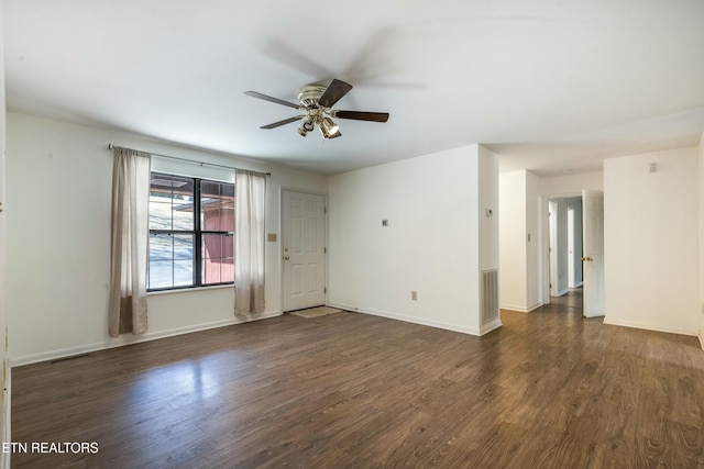 unfurnished room with visible vents, baseboards, ceiling fan, and wood finished floors