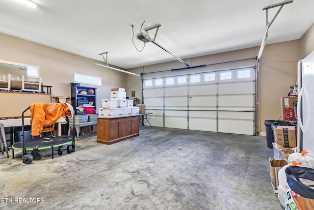 garage featuring a garage door opener