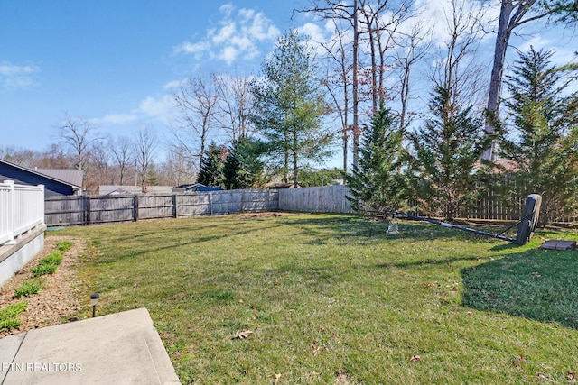 view of yard with a fenced backyard