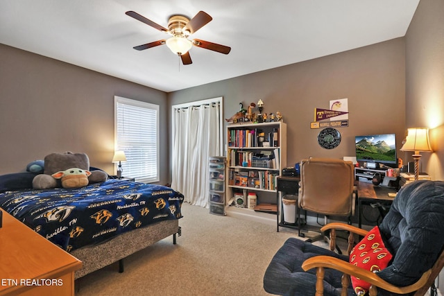 carpeted bedroom featuring a ceiling fan