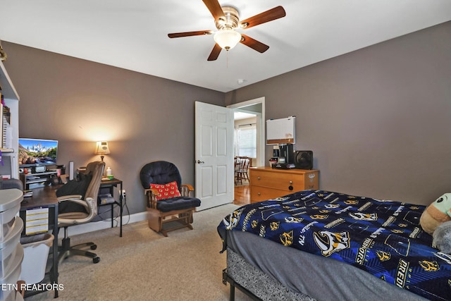 carpeted bedroom with baseboards and ceiling fan