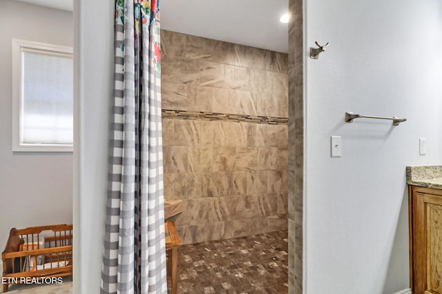 bathroom with vanity and walk in shower