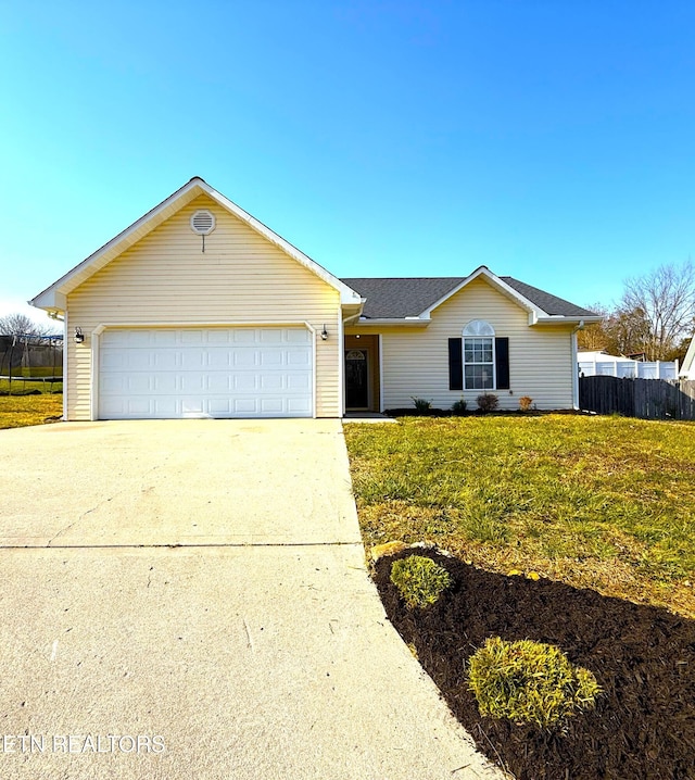 ranch-style home featuring a front lawn, fence, concrete driveway, roof with shingles, and a garage