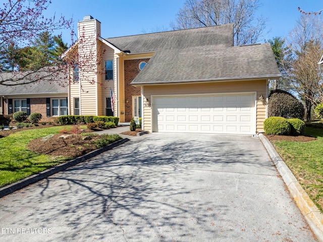 view of front of property with a garage, a chimney, driveway, and a shingled roof