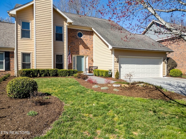 view of front facade featuring a shingled roof, a front yard, a chimney, a garage, and driveway