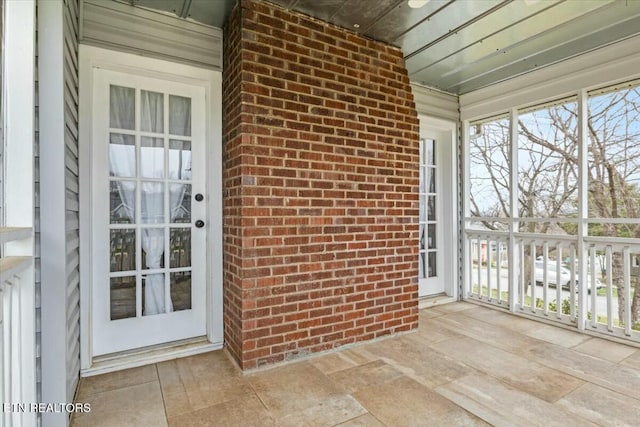 unfurnished sunroom with a wealth of natural light