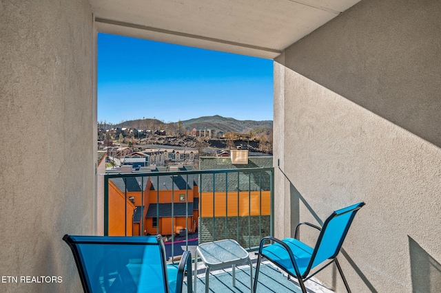 balcony featuring a mountain view