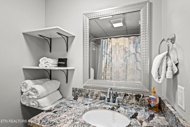 bathroom with vanity and a shower with shower curtain