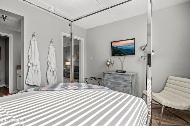 bedroom with wood finished floors