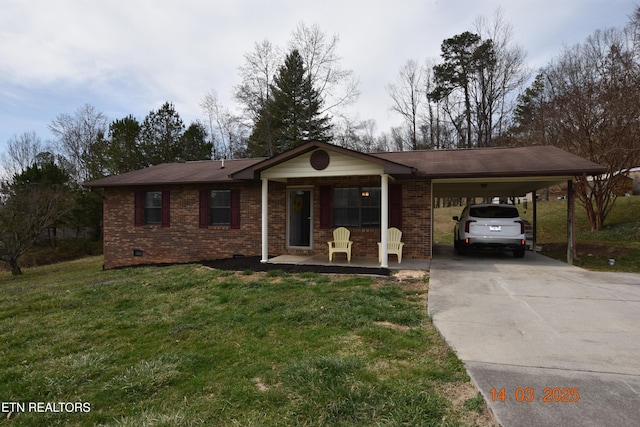 ranch-style home featuring a carport, covered porch, concrete driveway, a front yard, and brick siding