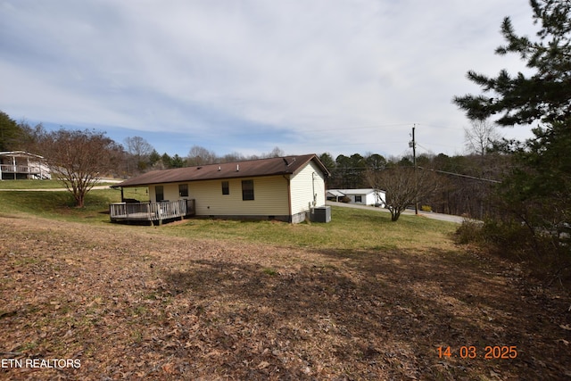 back of house featuring crawl space, central air condition unit, a yard, and a deck