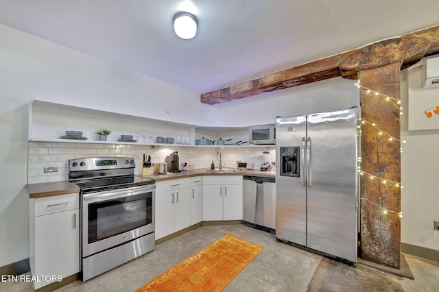 kitchen with decorative backsplash, stainless steel appliances, and open shelves