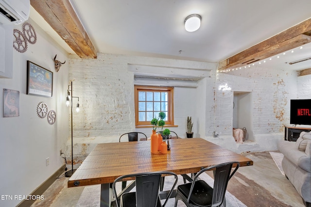 dining room with an AC wall unit and beamed ceiling