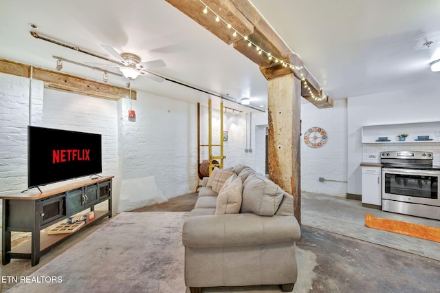 living room featuring unfinished concrete flooring and ceiling fan