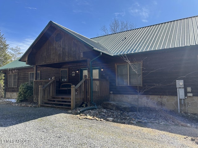 view of front of property with covered porch and metal roof