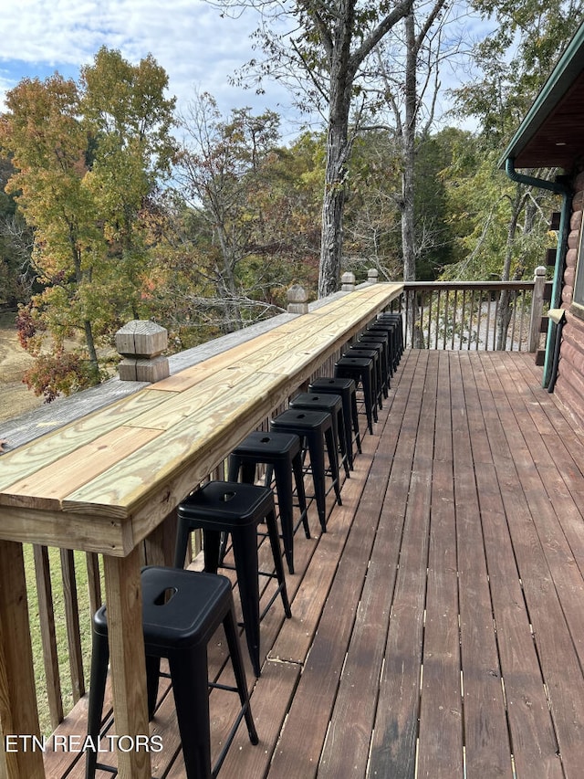 wooden terrace with outdoor dry bar