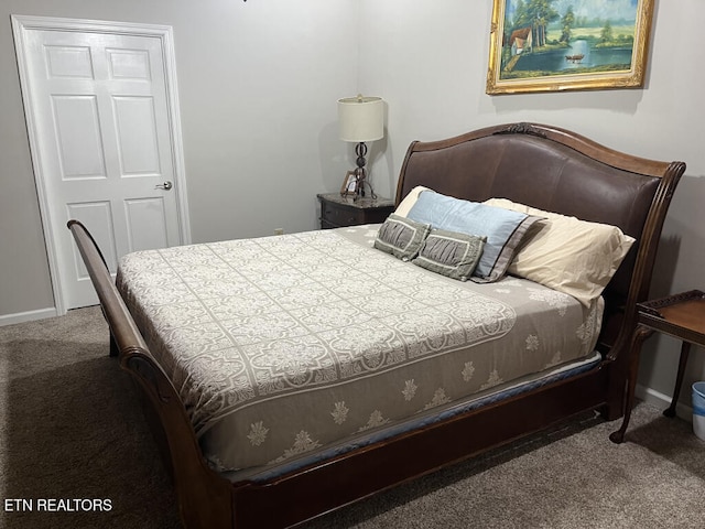 bedroom featuring baseboards and carpet floors