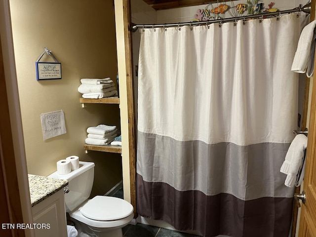 bathroom with vanity, a shower with shower curtain, and toilet