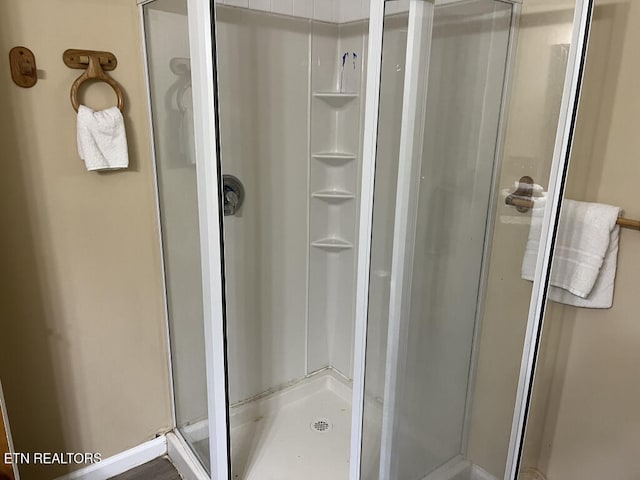 bathroom with a shower stall