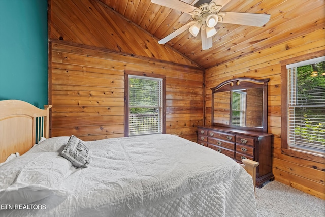 3725 Island View Rd, Sevierville, TN 37876 - carpeted bedroom with wooden ceiling, wooden walls, a ceiling fan, and vaulted ceiling with beams