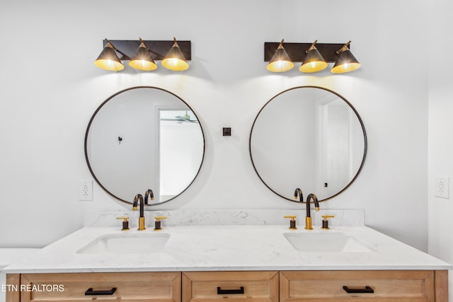 bathroom with double vanity and a sink