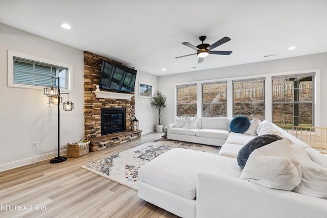 living room featuring recessed lighting, wood finished floors, baseboards, and ceiling fan