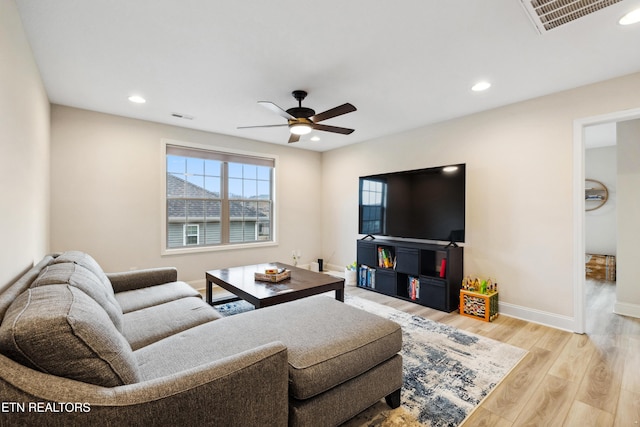 living area featuring visible vents, a ceiling fan, wood finished floors, recessed lighting, and baseboards