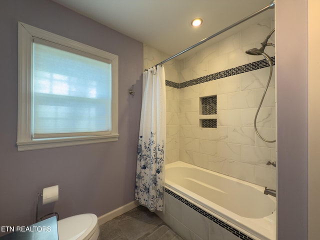 full bathroom with tiled shower / bath, toilet, and baseboards